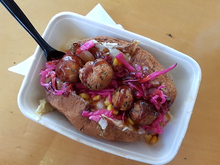 Baked Potato with corn, pineapple, pickled cabbage, falafel and BBQ sauce at Brisbane Vegan Markets
