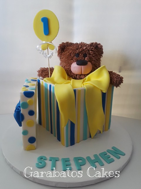Cuddly Birthday Bear - This is a red velvet cake covered with my homemade delicious cream cheese icing. The whole cake is edible, even the bear! By Violeta Ugalde of Garabatos Cakes
