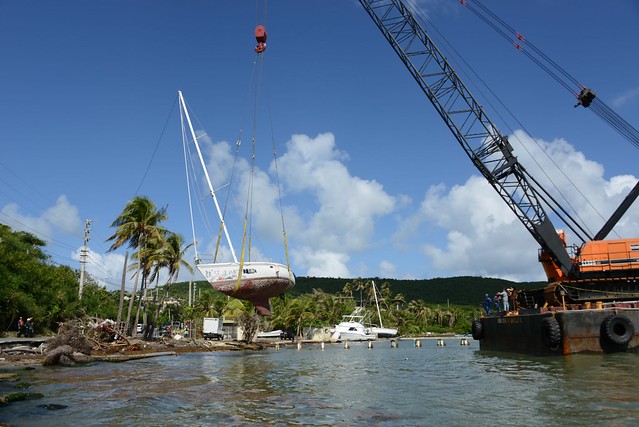 Hurricane Maria salvage crews remove wrecked boat from road
