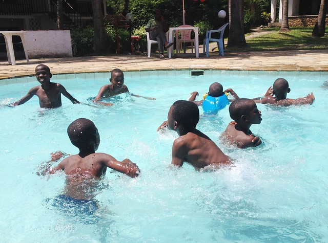 The boys enjoy the swimming pool at Milele Beach Hotel