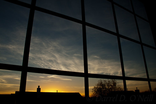 window squares house roof skyline sky cloud sunrise tree silhouette morning early panes wispy stlouis missouri illinois fairviewheights blue white yellow golden black