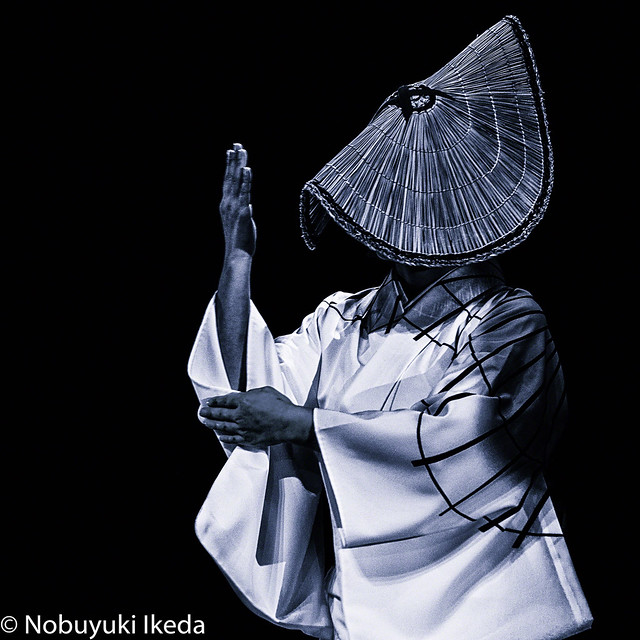 "A woman wearing an umbrella" Black and white version 1"