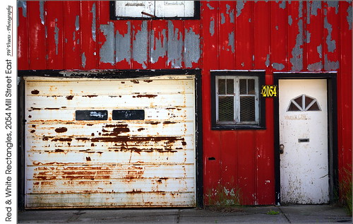gorrie millstreeteast farmationbuilding rectangles rusty doors paint peeling weathered red redrule opensource rawtherapee gimp nikon d7100 nikkor50mmf18d