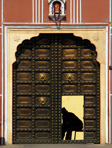 Door with guard at Hara Mahal, the Palace of the Winds in Jaipur India