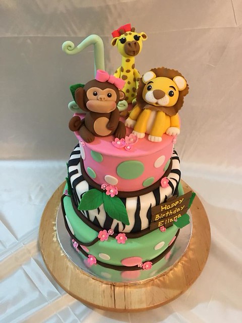 A jungle themed 1st birthday cake. Animals are handmade and everything is edible by Johanna Sepulveda-Shah