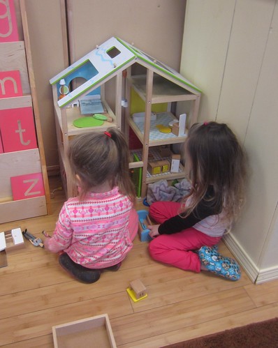 playing with the doll house