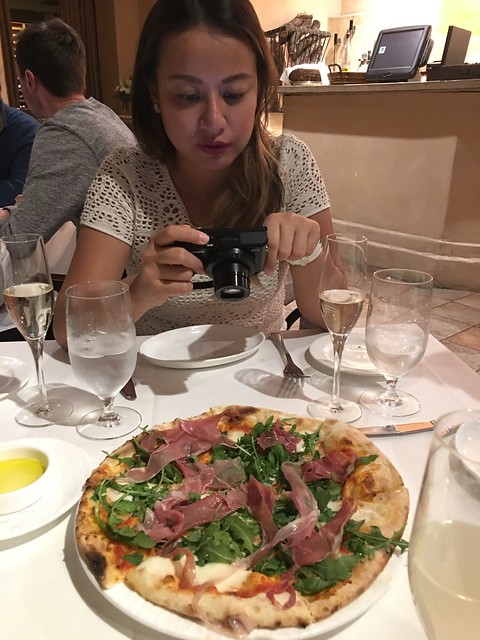 Yen taking a photo of the pizza, Prima