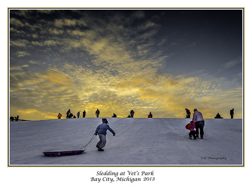 snow sled sledding winter hill slope slopes vets baycity kids fun sunset brilliantsky clouds yellowcolor yellow color tomclarkphotographycom tacphotography tomclark d5100