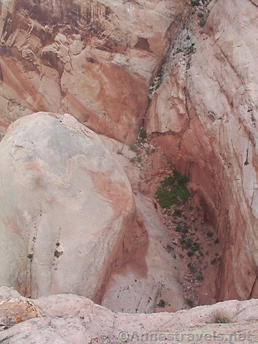 Looking down on the trail, far, far below, to Brimhall Arch, Capitol Reef National Park, Utah