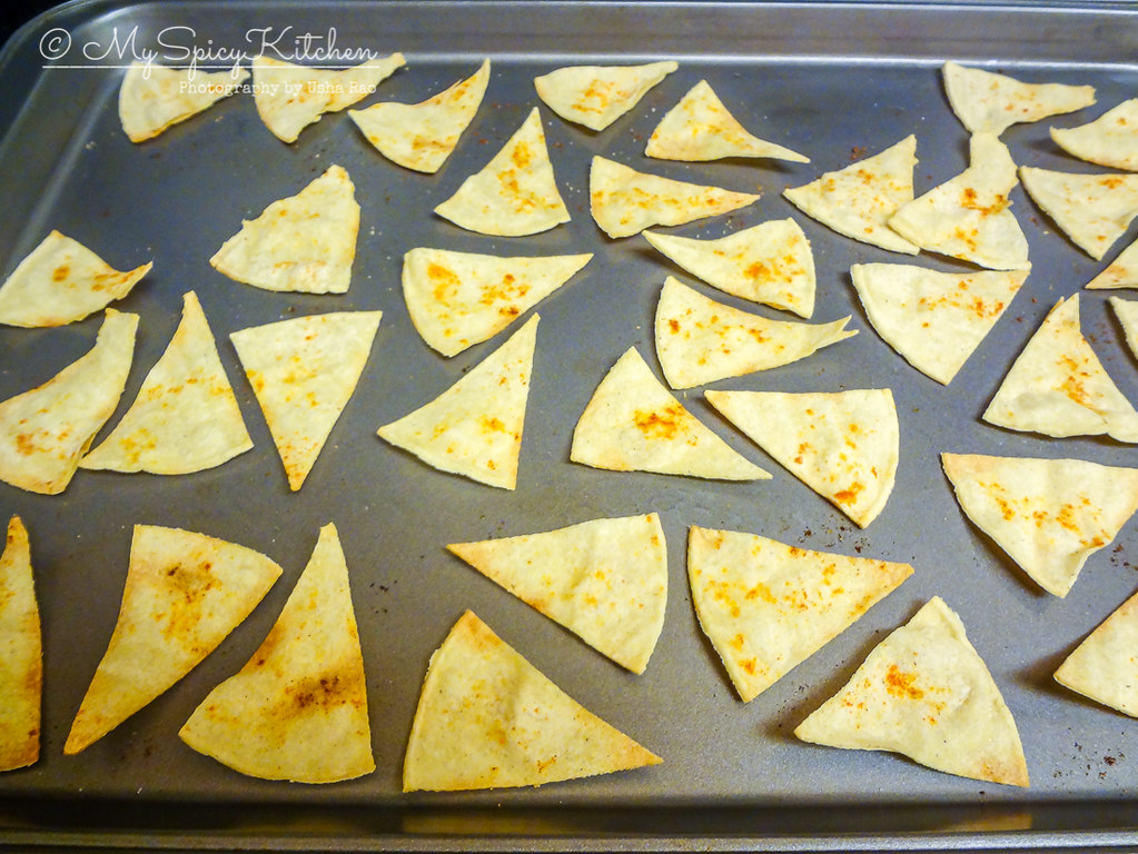 A baking sheet of semi homemade corn tortilla chips.