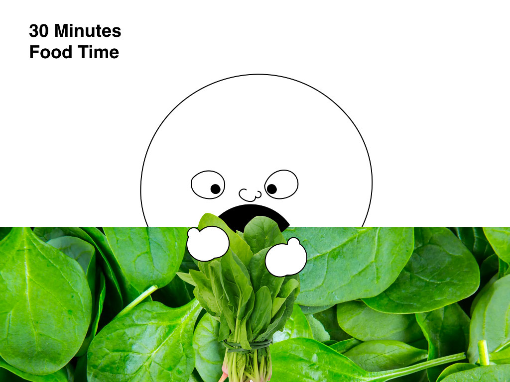 a giant cartoon head eating spinach