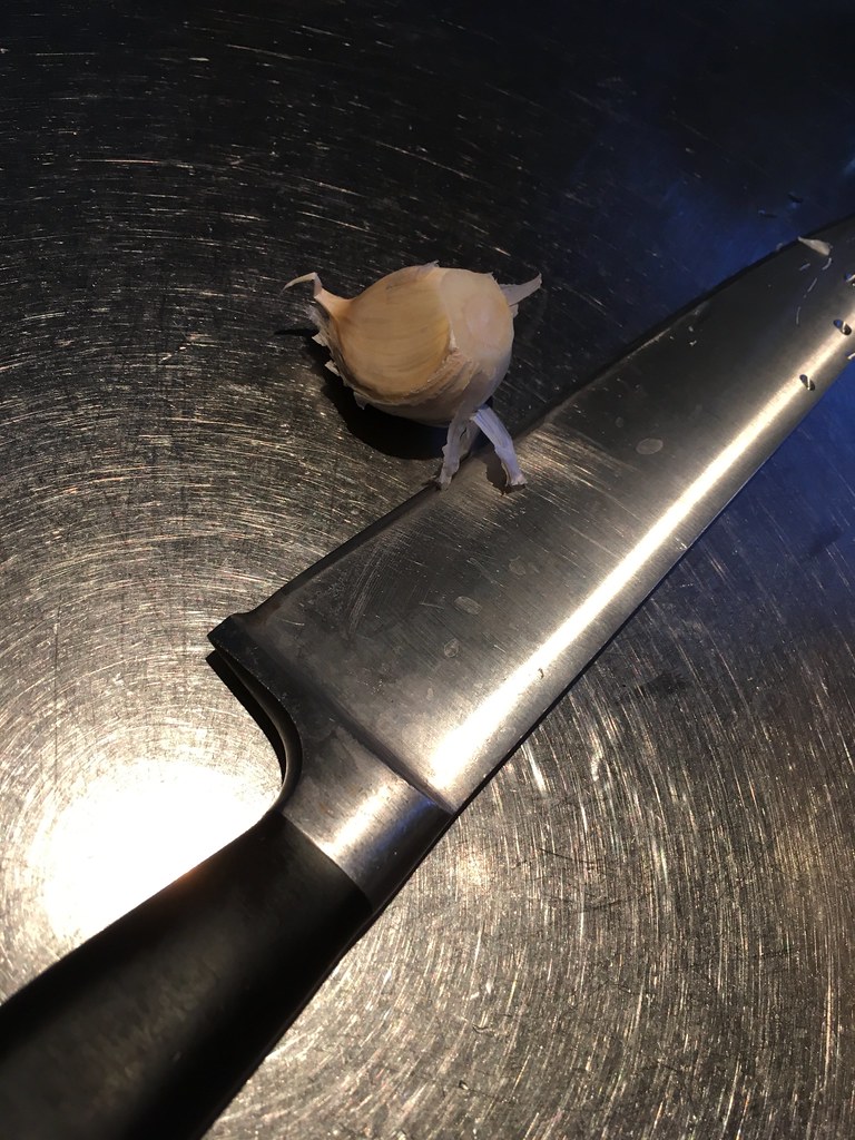 A knife and a piece of garlic, on the beginning of CurryJam 2nd day