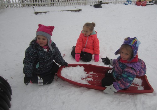 girls and a sled
