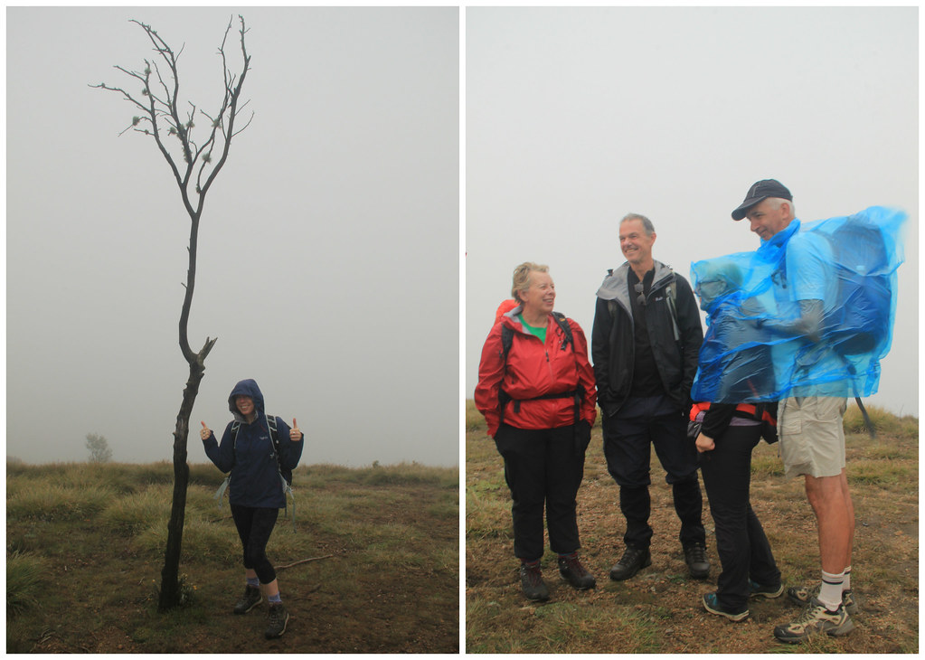 Yep, the view's great up here! But at least Pete's rain poncho is big enough to fit most of the group underneath!