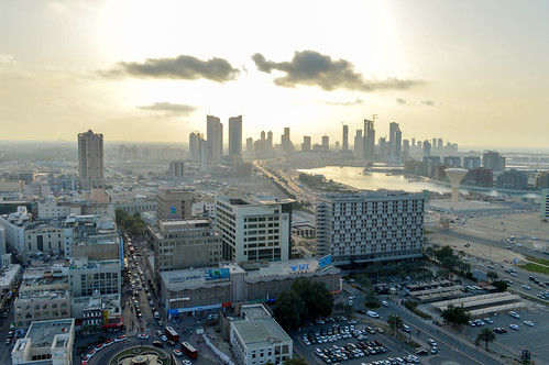 ngc bahrain manama city skyline view afternoon buildings clouds skyscrapers