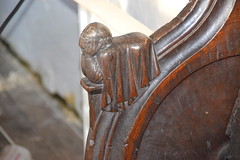 stall arm: sloth (man in bed) (15th Century)