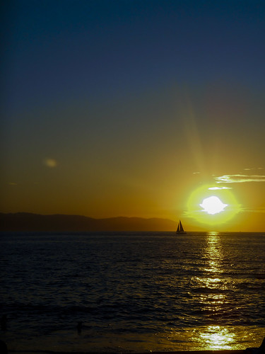 puertovallarta mexico pacificocean ocean sea water reflection sun sunset sunflare sailboat silhouette mountains sky colours nikonps jpeg dscn1842