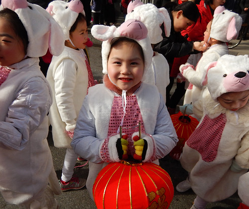 Sweet little girls dressed as puppies for the Year of the Dog. Chinese New Year Parade in Vancouver, Canada