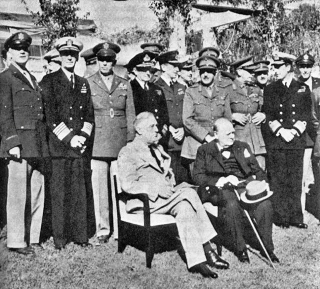 United States President Franklin D. Roosevelt, British Prime Minister Winston Churchill, and their advisors -- front row, left to right: General Arnold, Admiral King, General Marshall, Admiral Pound, Air Chief Marshal Portal, General Brooke, Field Marshal Dill, and Admiral Mountbatten.-- in Casablanca, January 1943.