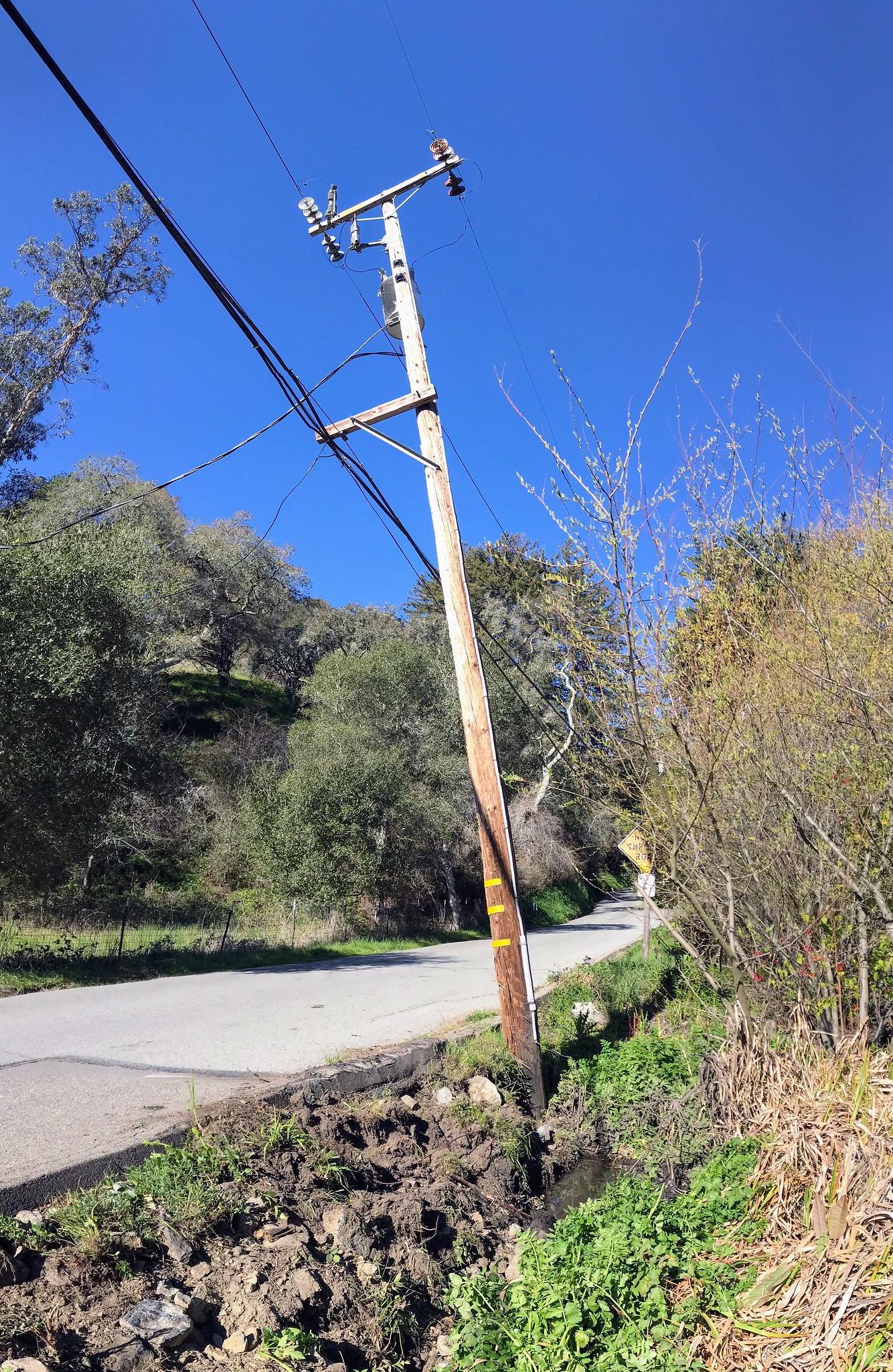 Leaning power pole