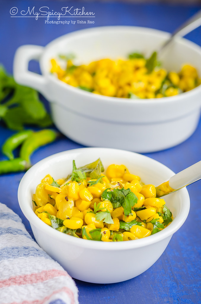 Bowl of sauteed sweet corn kernels in the forefront and a casserole of sauteed corn in the back