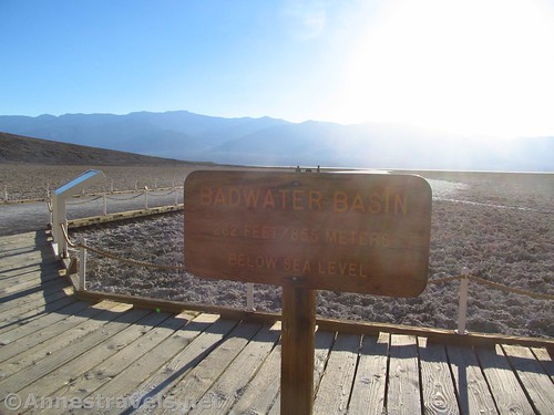 Badwater Basin sign in Death Valley National Park, California. Of course, the pictures aren't very good with the sun behind them. Badwater is best visited in the later morning.