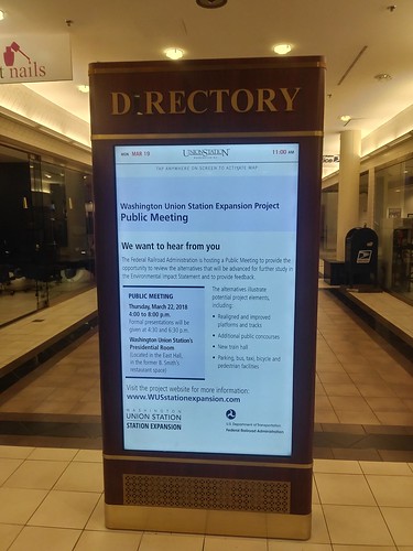 Public notice of Union Station Master Planning meeting, on ad kiosk at Union Station