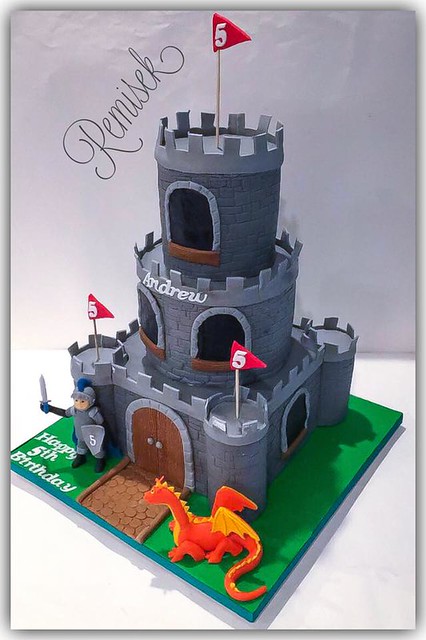Knight and Dragon Castle Cake. Hand crafted edible Knight and Dragon. By Remisek Bakes