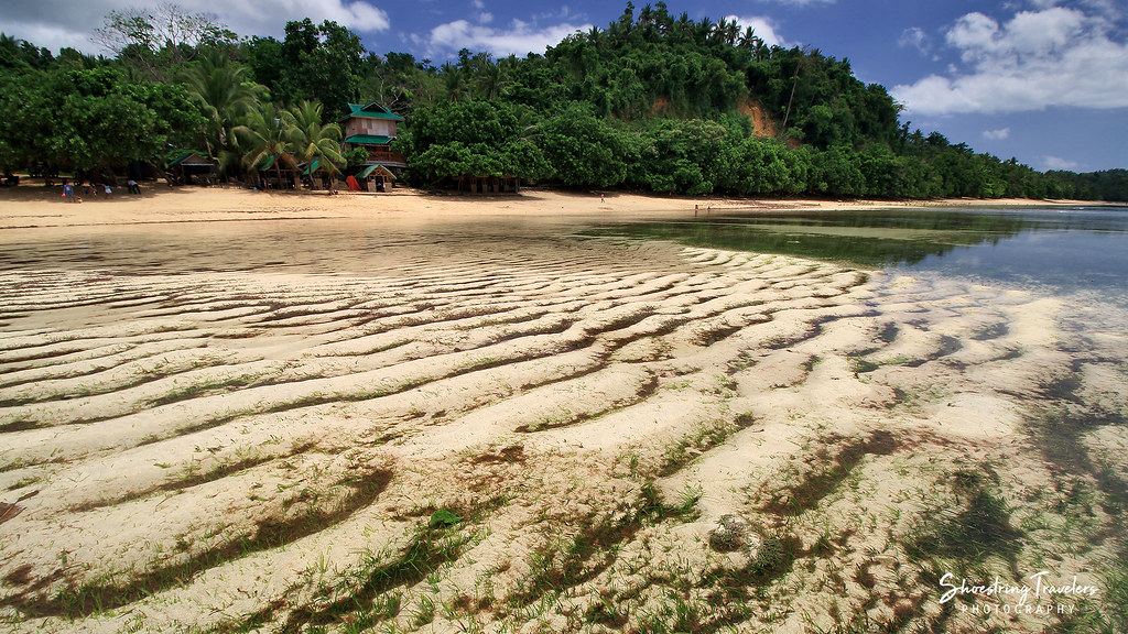 sand ripples and sea grass at Mamangal Beach