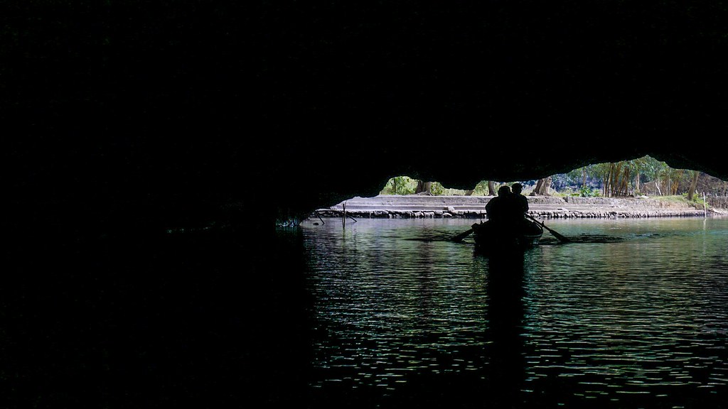 Boat exiting a cave in Tam Coc, Vietnam