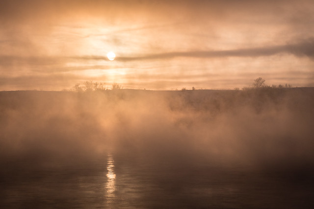 foggy sunrise across the river