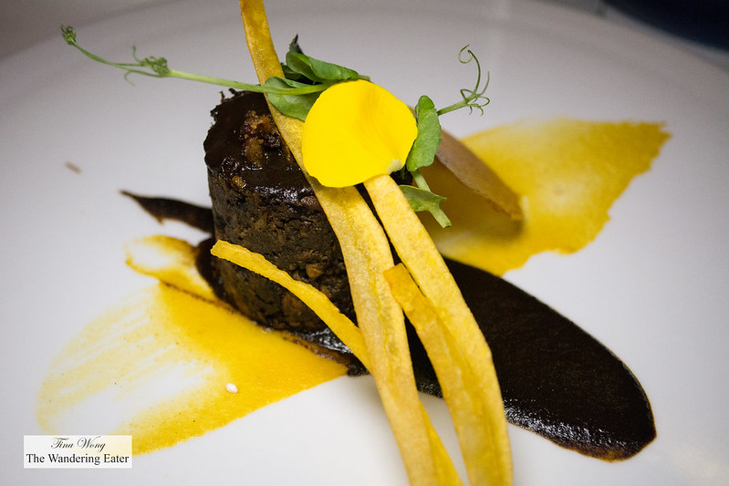 Duck in mole negro, fried banana plume served with corn flavored rice