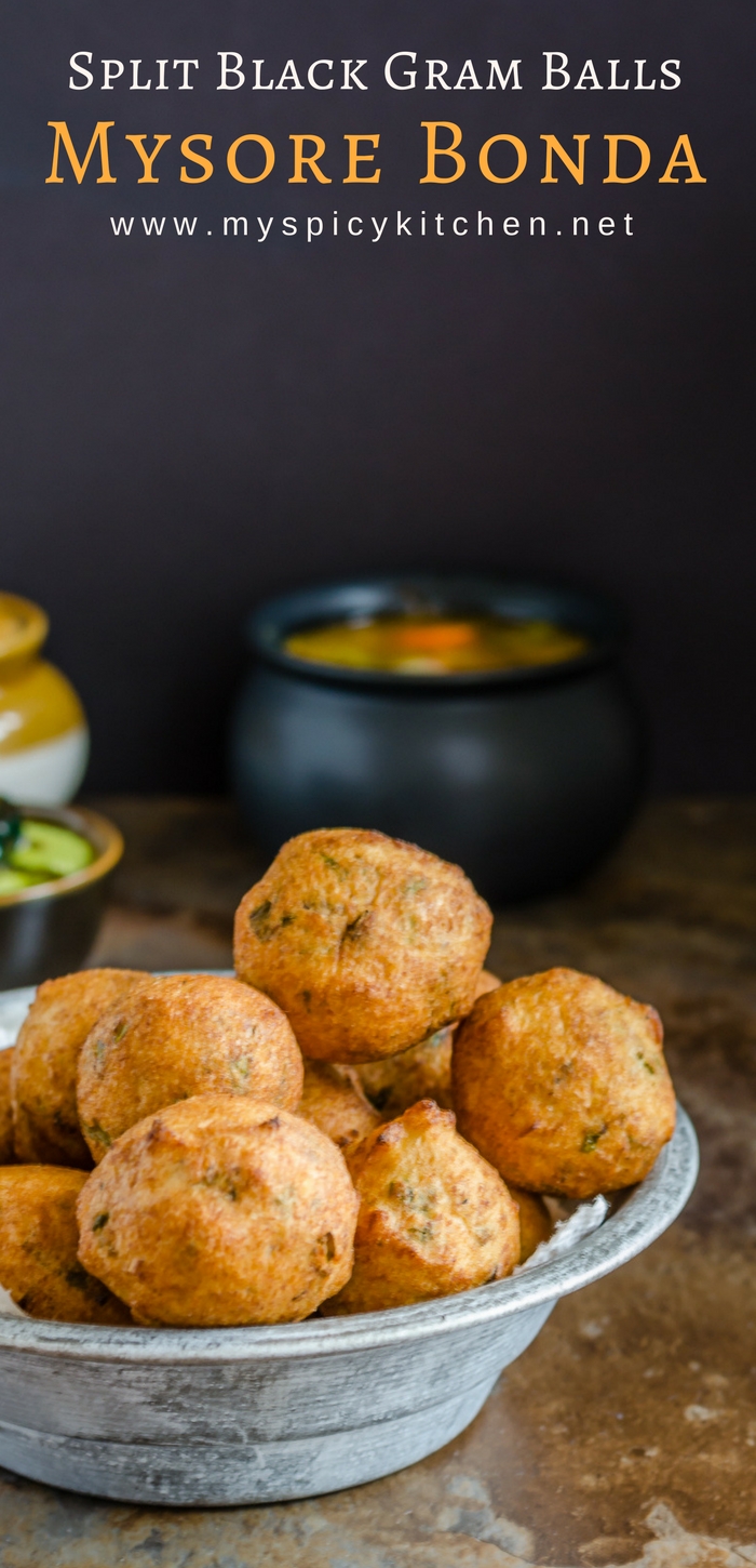 A bowl of Mysore bonda which is prepared with urad dal.  Mysore bonda is a crispy, spongy, deep fried snack made with split black lentils or urad dal and is served with coconut chutney.  
