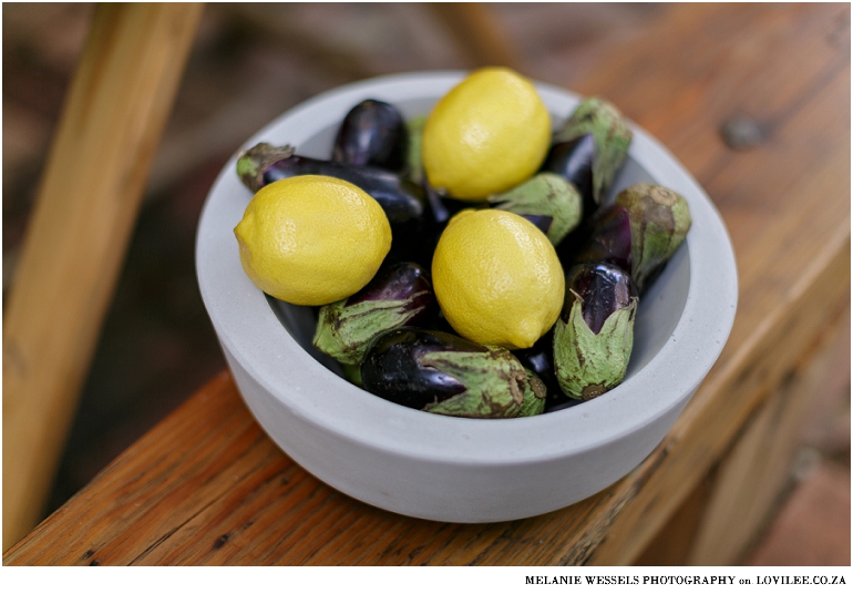 Brinjals and lemons in a cement bowl from The WJ Collection