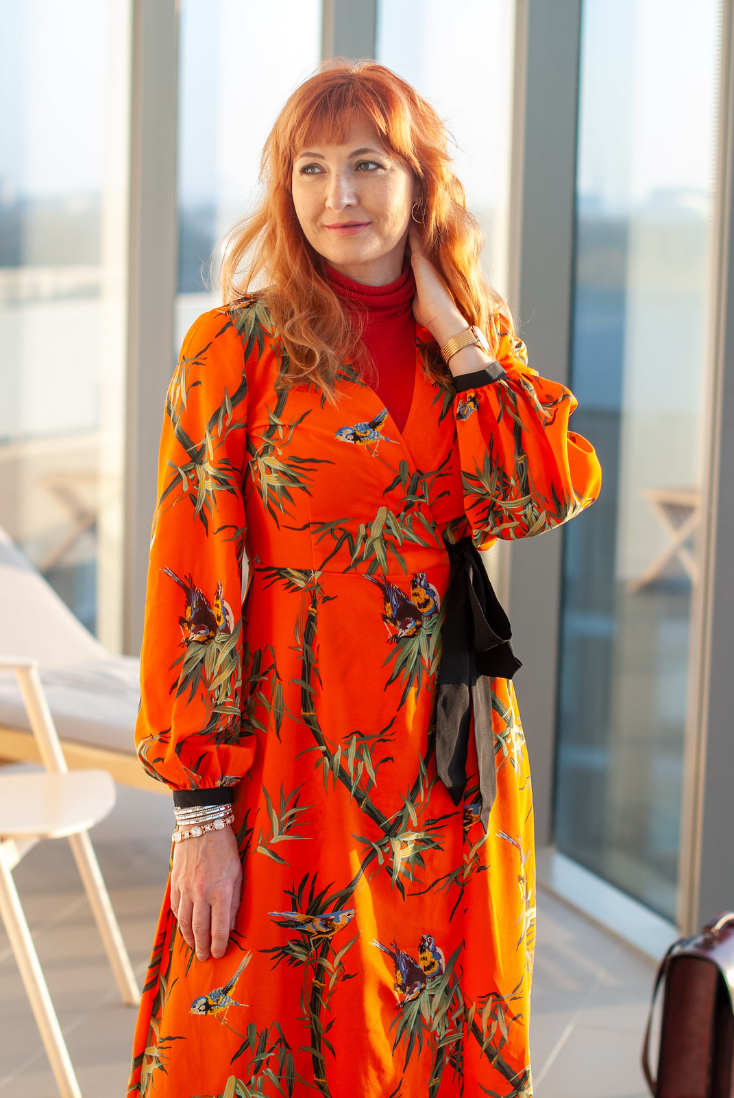 Layering a Midi Dress and Trousers Under a Tailored Coat \ orange floral midi dress \ navy pinstripe tailored coat \ emerald green trousers \ snakeskin and suede ankle boots \ Beara Beara leather backpack | Not Dressed As Lamb, over 40 style