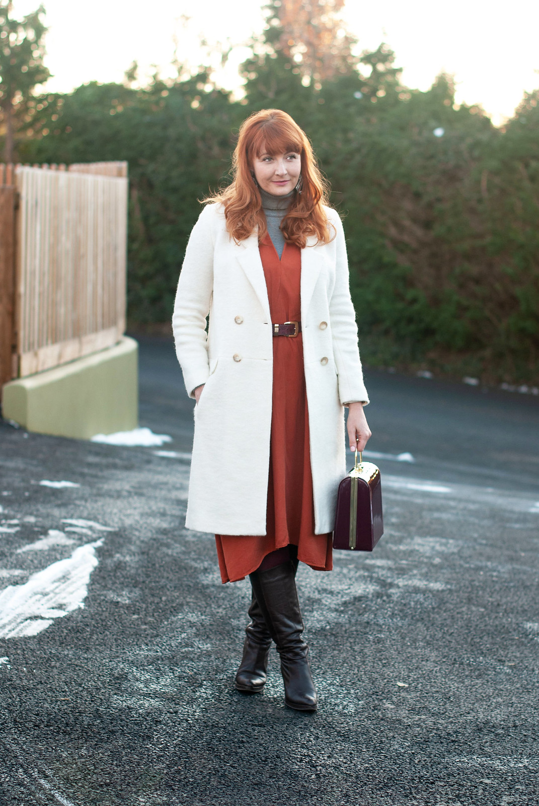 The Magic Powers of a Winter White Coat \ longline winter white wool coat \ burnt orange midi dress \ brown knee high boots \ grey roll neck | Not Dressed As Lamb, over 40 style blogger