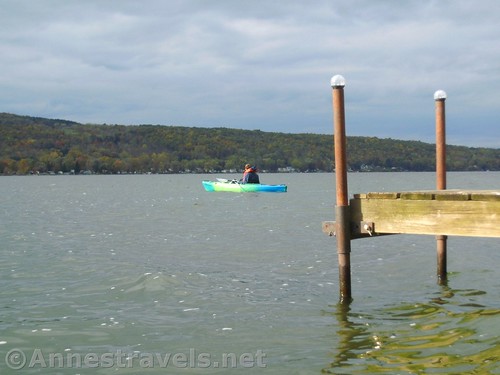 Waiting for me to get around the dock and join him so we can paddle straight across Honeoye Lake, New York