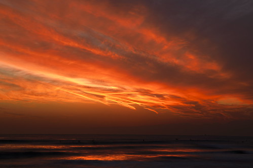 sunset beach eveningglow reflections red
