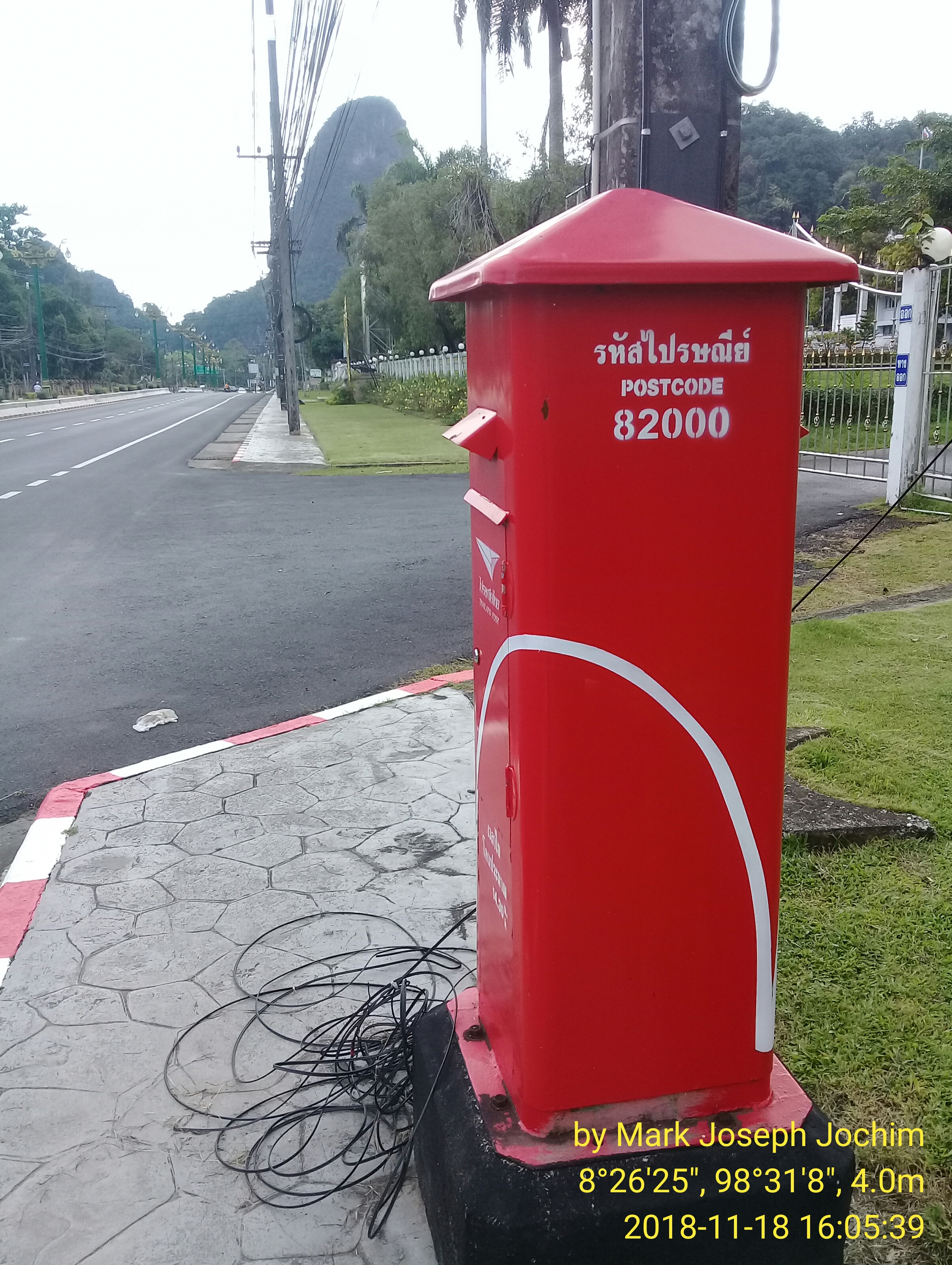 Square Thailand Post pillar box in the center of Phang Nga Town, Thailand. Photo taken by Mark Joseph Jochim on November 18, 2018.