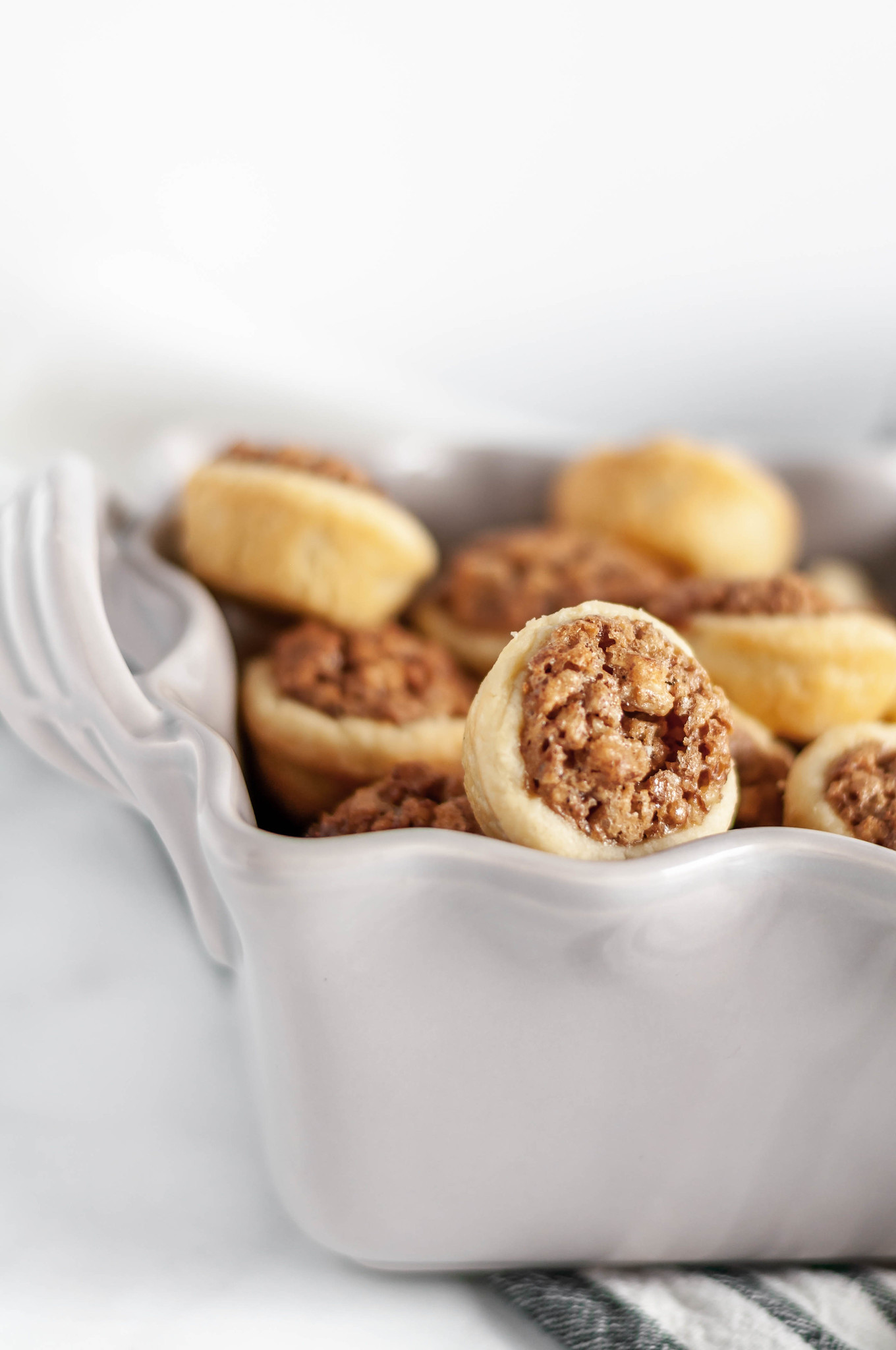 Mini Pecan Pies have all the traditional flavor of a traditional pecan pie in mini form and without the corn syrup. Only 40 minutes from start to finish make these a simple and delicious option for your Thanksgiving dessert table.