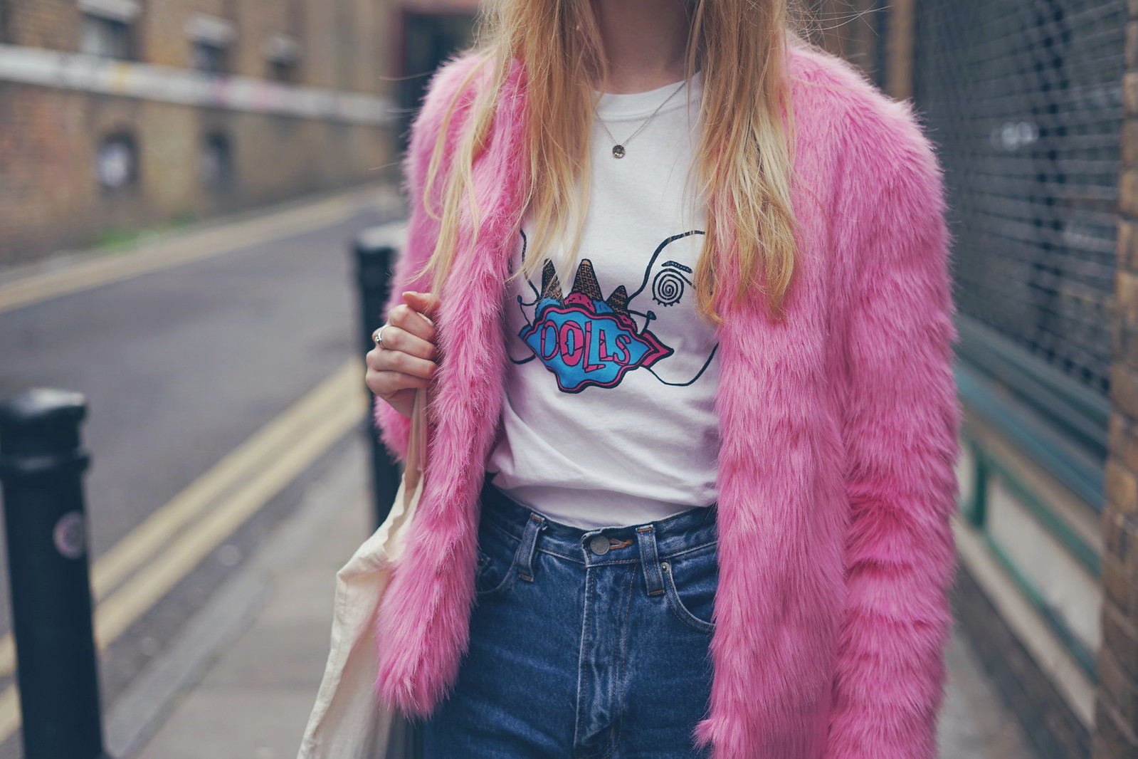 A band tee and a faux fur coat