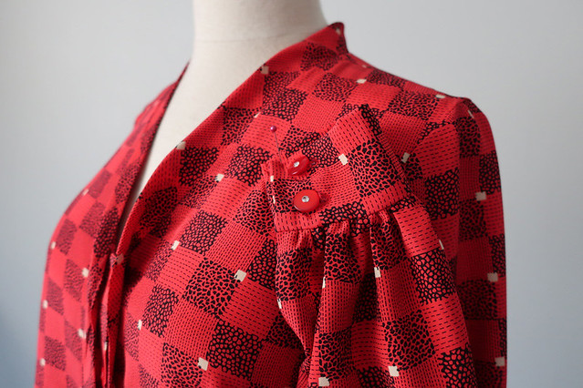 Red bow blouse cuff buttons