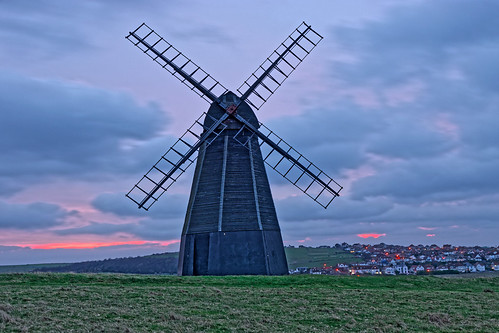 windmill mill building architecture structure historic sails skirt sunrise dawn daybreak morning cloud sky grass village lights houses rottingdean sussex