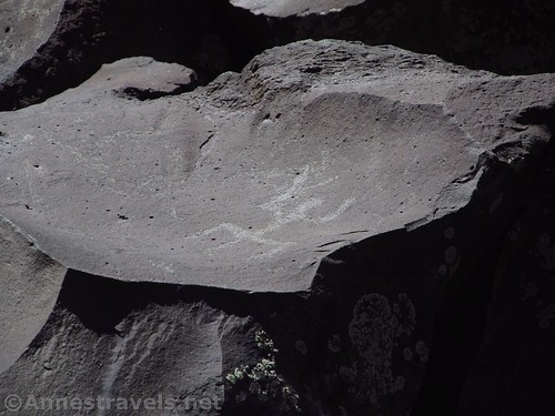 Petroglyph of a man on top of a rock at Nampaweap Rock Art Site in Grand Canyon-Parashant National Monument, Arizona