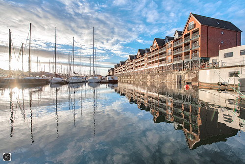 sunrise winter weather yachts boats sailing marina maritime apartments flats homes buildings reflections water liverpool sunshine clouds england masts sky docks harbour nikon photography