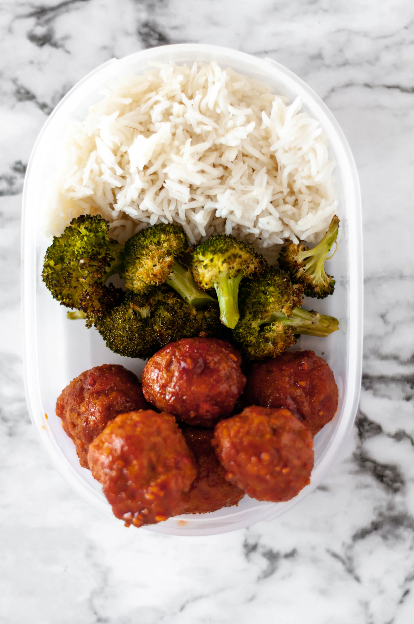 Korean Meatball Meal Prep makes a delicious lunch throughout the week. Baked on a sheet pan along with broccoli. Spicy and so flavorful.