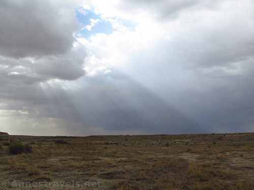 Sun filtering through the clouds over the New Mexican Desert near the Valley of Dreams in the Ah-Shi-Sle-Pah Wilderness