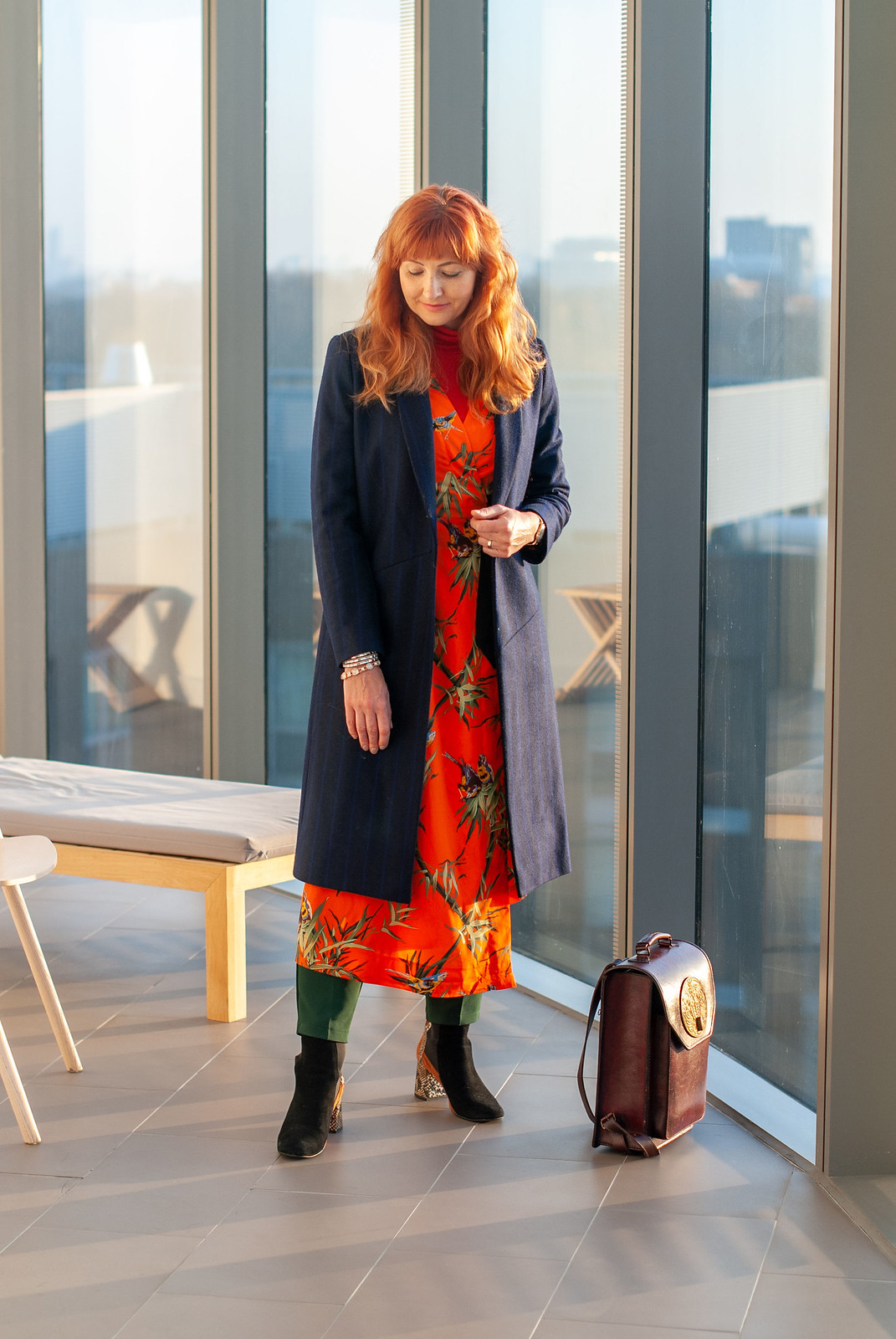 Layering a Midi Dress and Trousers Under a Tailored Coat \ orange floral midi dress \ navy pinstripe tailored coat \ emerald green trousers \ snakeskin and suede ankle boots \ Beara Beara leather backpack | Not Dressed As Lamb, over 40 style