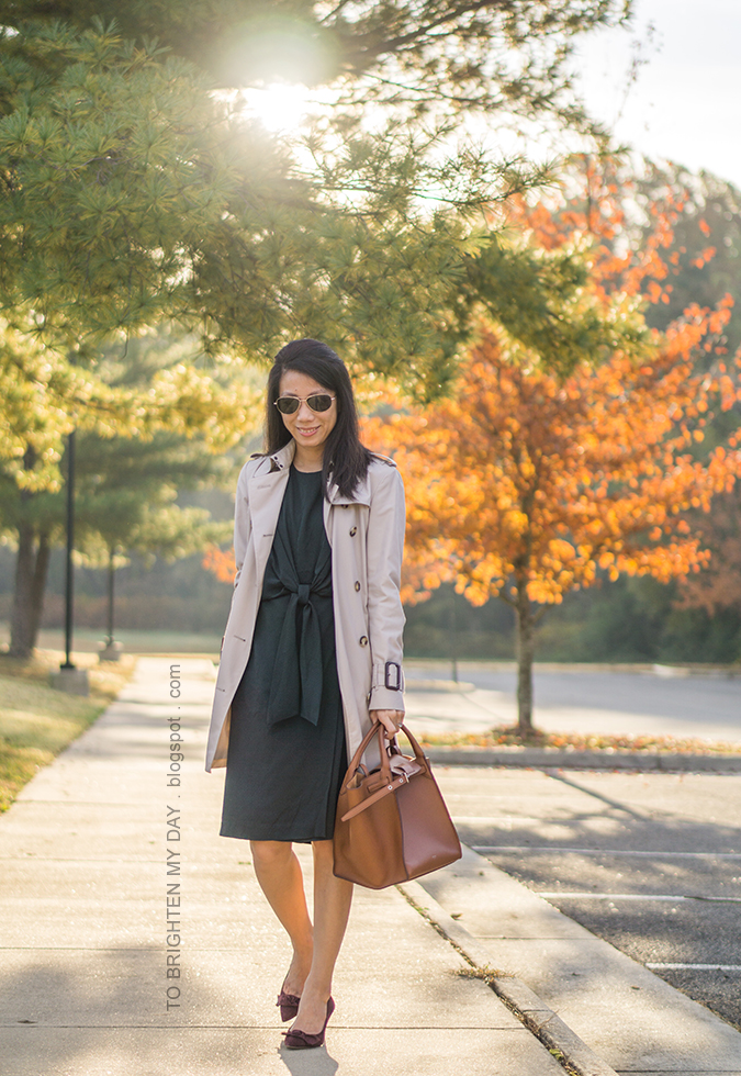 trench coat, hunter green tie front dress, brown tote with belt, berry suede pumps with bow