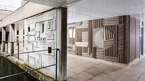 Sculptural relief concrete panels line pedestrian walkways at the University of York